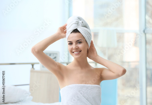 Beautiful young woman after shower at home