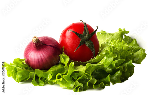 Tomatoes, lettuce and onion on a chopping board