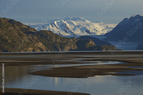 Lago Grey surrounded  mountain peaks in Torres del Paine National Park in Patagonia, Chile. Glacier Grey in the distance. photo