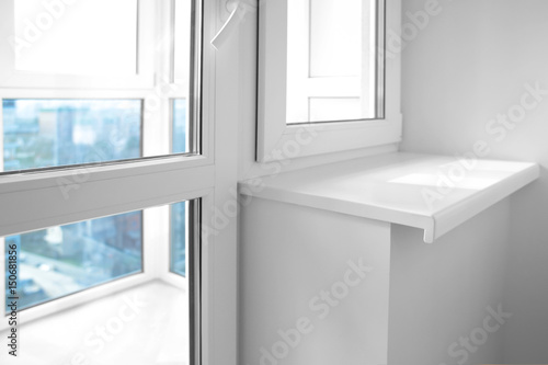 Modern metal-plastic window and door in new apartment