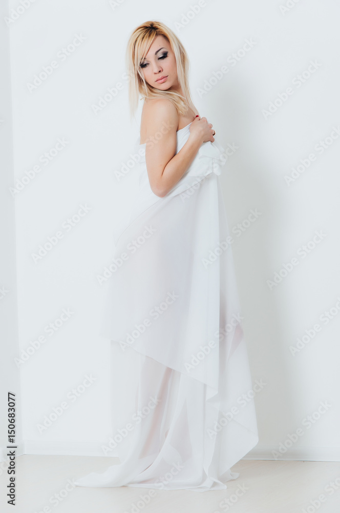 Topless blonde, covered with a white cloth Topless blonde, covered with a white cloth
