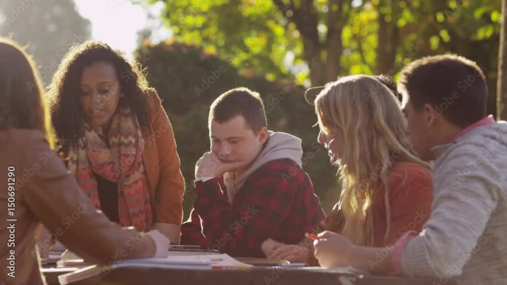 Group of college students on campus meeting outdoors Group of college students on campus meeting outdoors