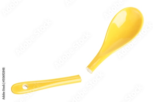 Broken yellow ceramic spoon