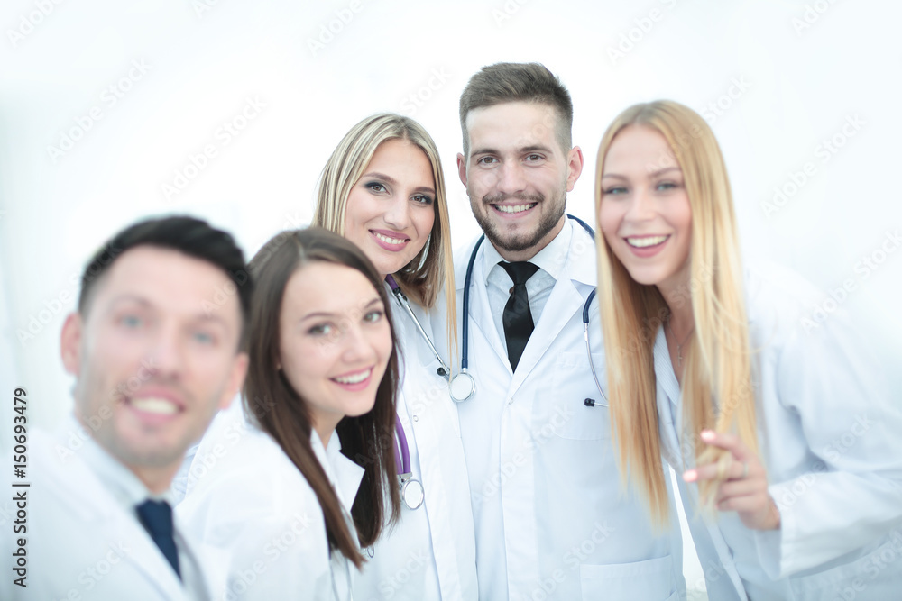 Happy doctors are making selfie using a smartphone and smiling.