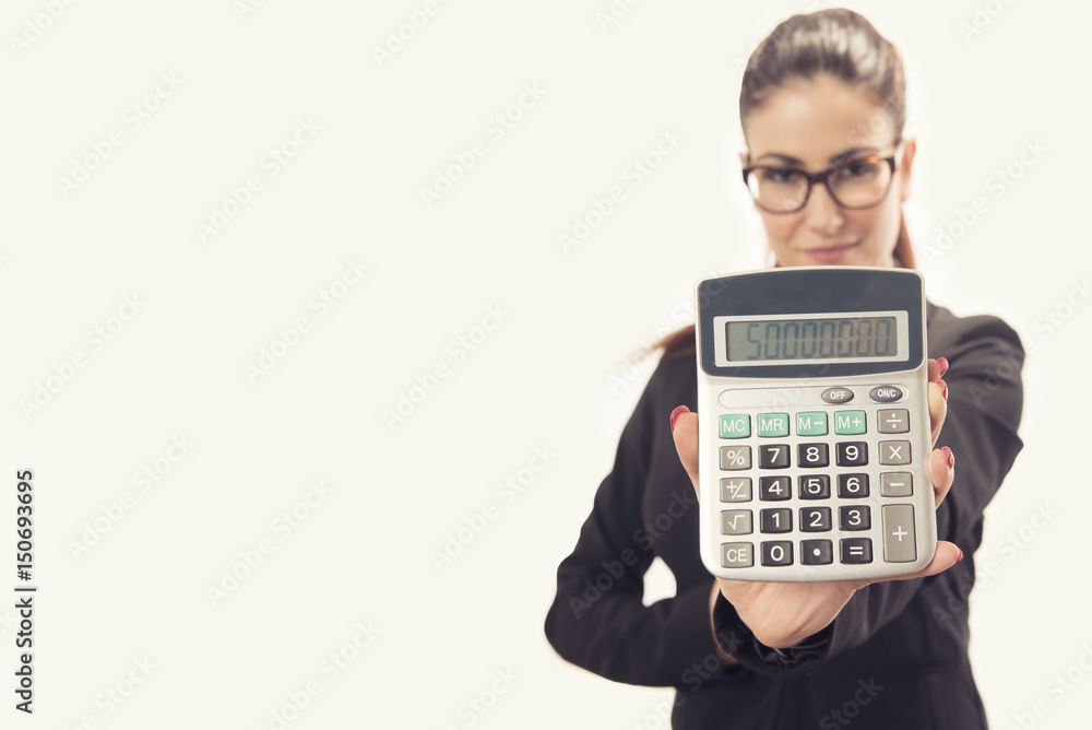 Isolated young business woman showing calculator Isolated young business woman showing calculator