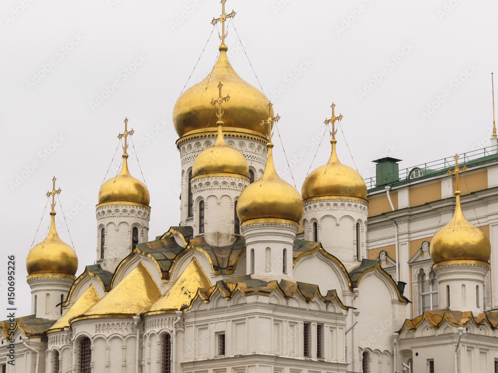 Annunciation Cathedral, one of the churches in Cathedral Square at the Kremlin in Moscow. Curved corbel arches known as kokoshniki support its multiple onion domes.