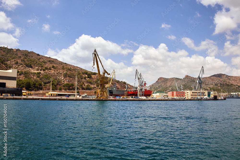 Seaport of Cartagena, Spain. Cartagena Shipyards, sea cranes, the Mediterranean Sea.