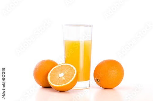 Glass of orange juice and oranges on white bacground