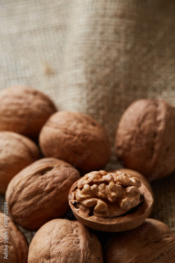 Walnuts on a rough burlap fabric Walnuts on a rough burlap fabric