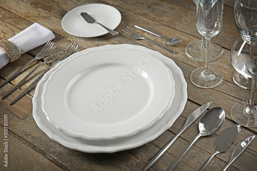 Table setting on wooden background