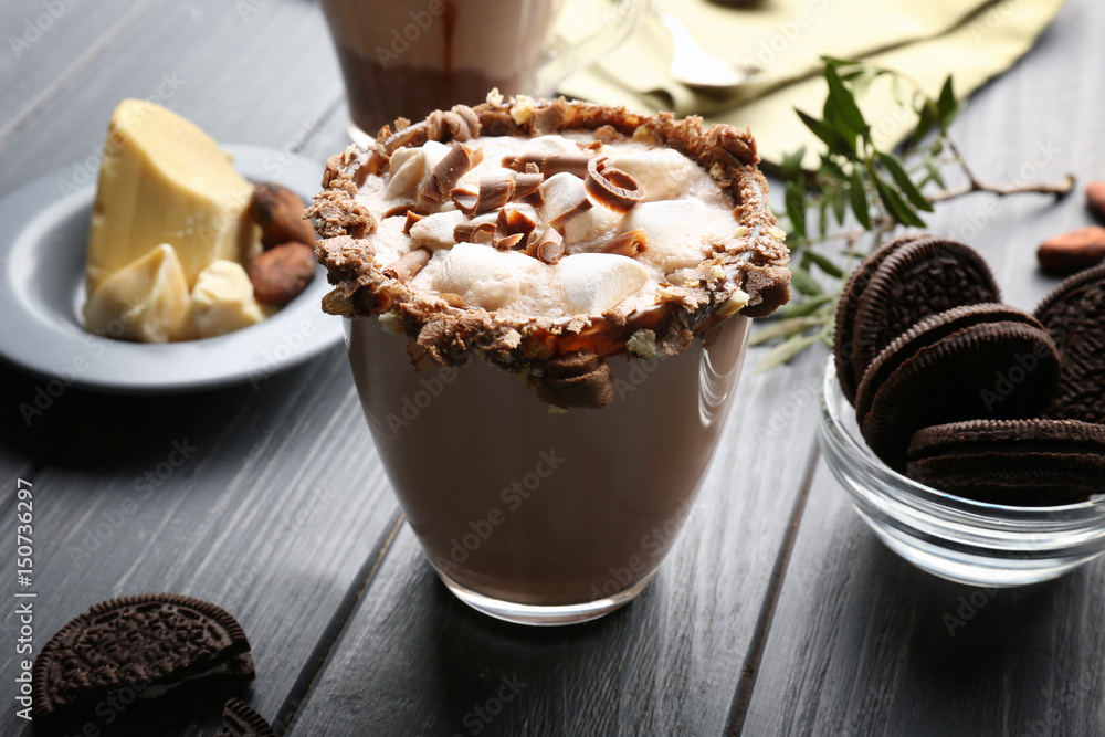 Composition with tasty cocoa drink on wooden table Composition with tasty cocoa drink on wooden table