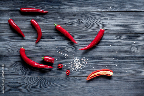 spicy food cooking with red chili wooden table background top view