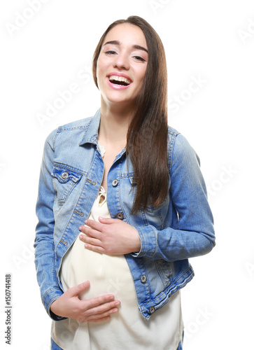 Young pregnant woman on whi...