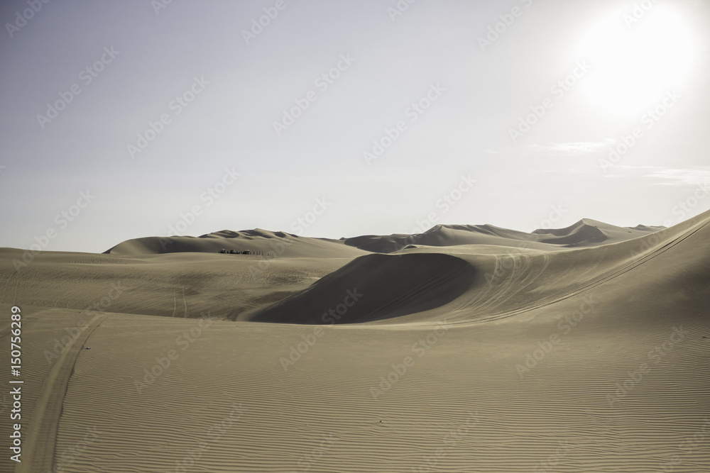 Sunset in the desert dunes of Huacachina, Peru