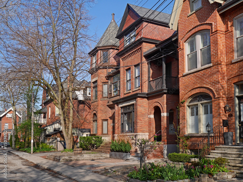 street with Victorian style brick houses street with Victorian style brick houses