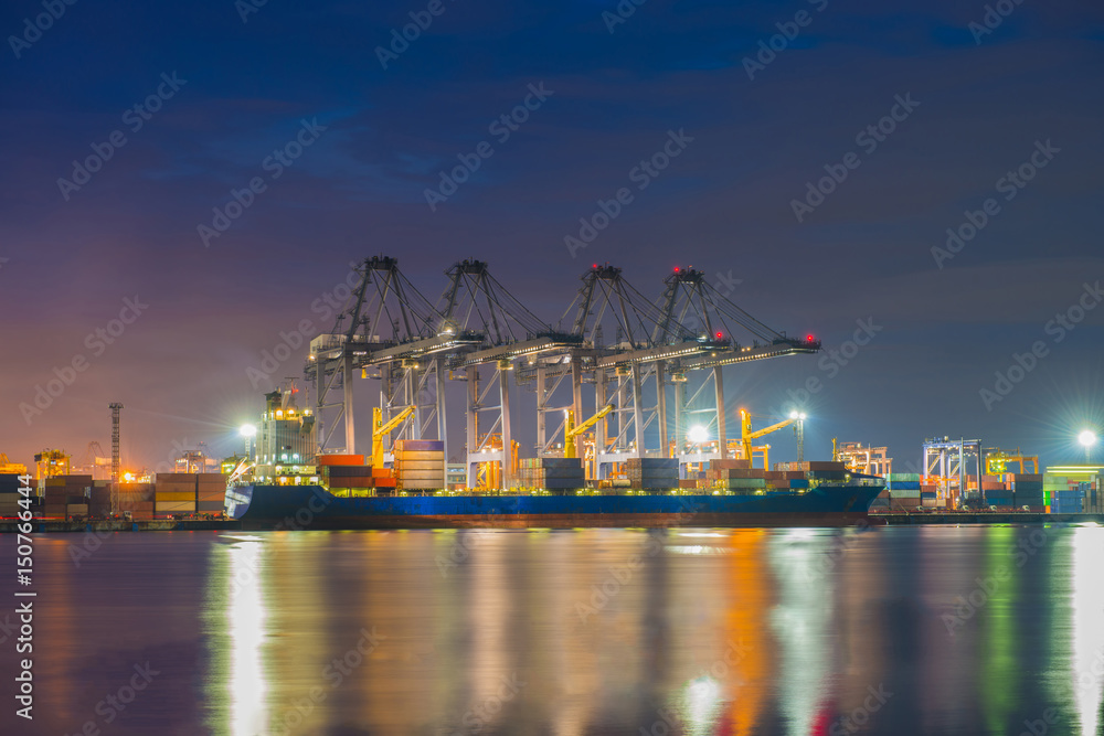 Industrial port with containers cargo ship in the trade port, shipping, transportation, logistic import export at sunset, twilight time.