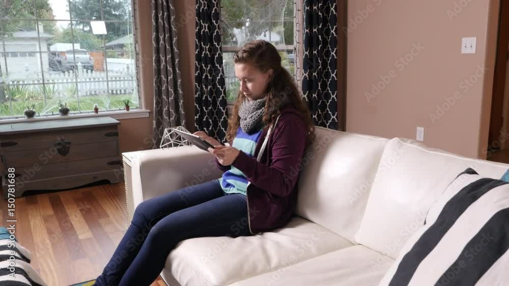 Woman using digital tablet at home Woman using digital tablet at home