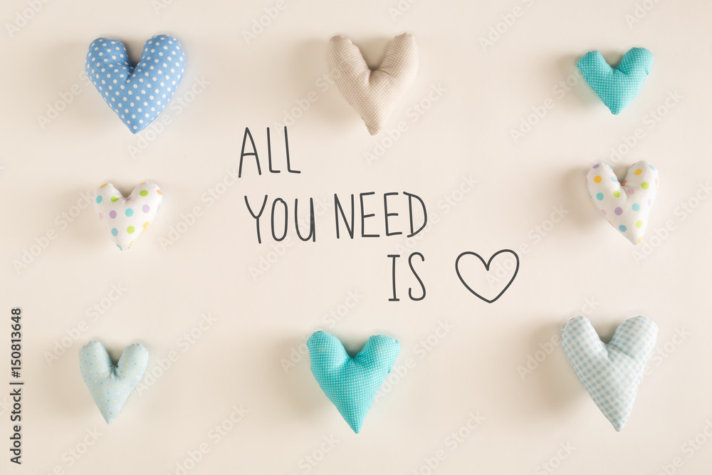 Fototapeta premium All You Need Is Love message with blue heart cushions