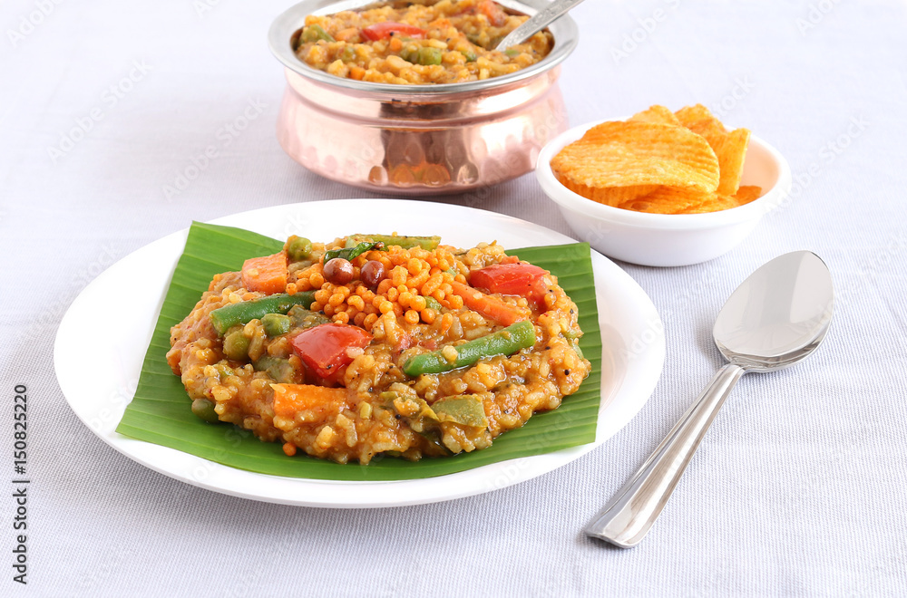 South Indian traditional and popular vegetarian rice dish, bisi bele bath, which has rice, vegetables and pigeon pea as the main ingredients. South Indian traditional and popular vegetarian rice dish, bisi bele bath, which has rice, vegetables and pigeon pea as the main ingredients.