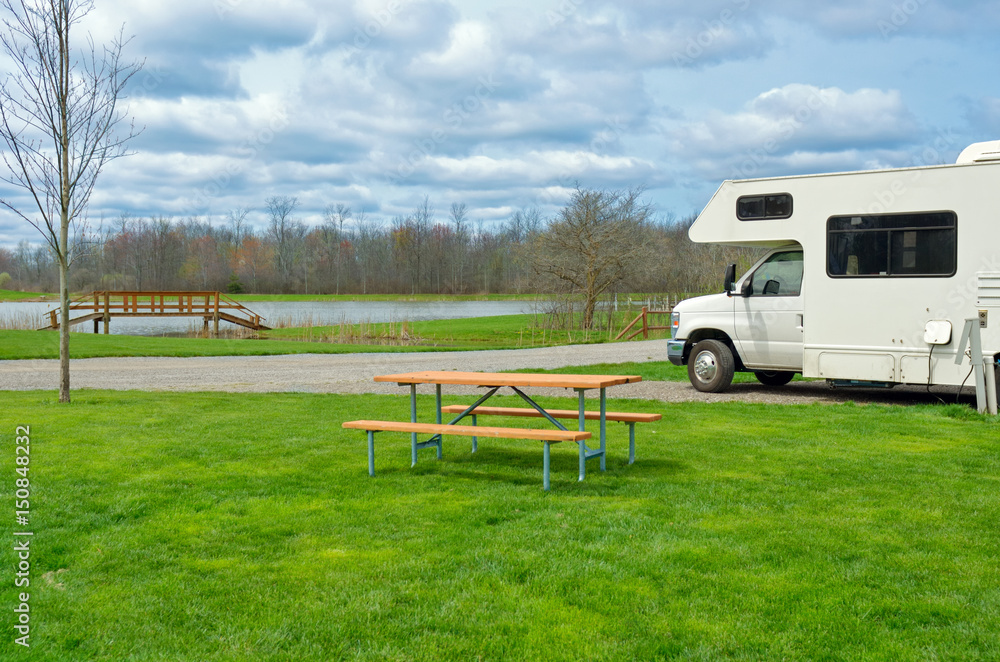 RV (camper) in camping, family vacation travel, holiday trip in motorhome
