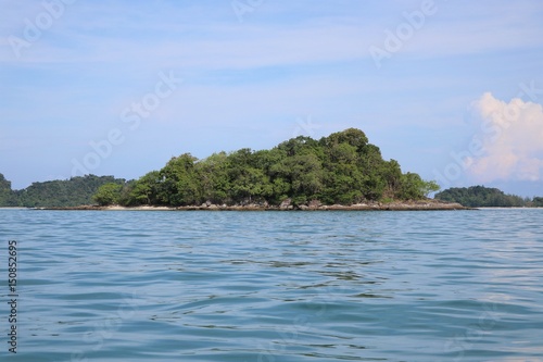 Small island with sea clam and clear background © louisnina