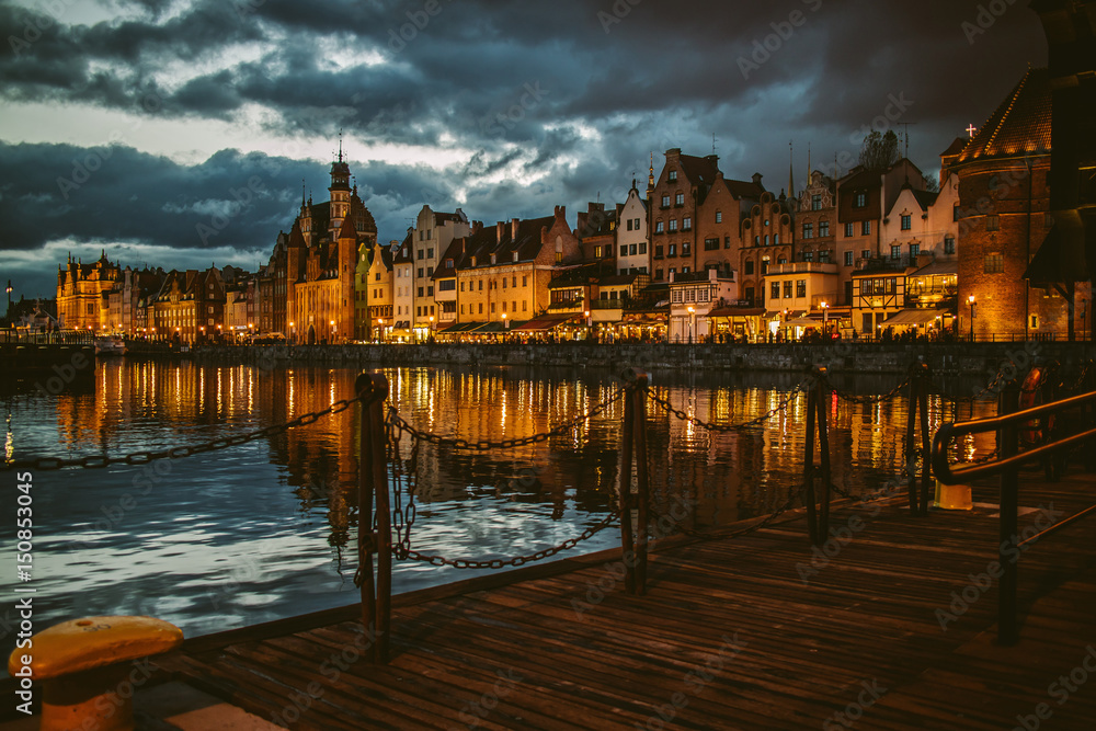 The old town in Gdansk at the evening as seen from harbor