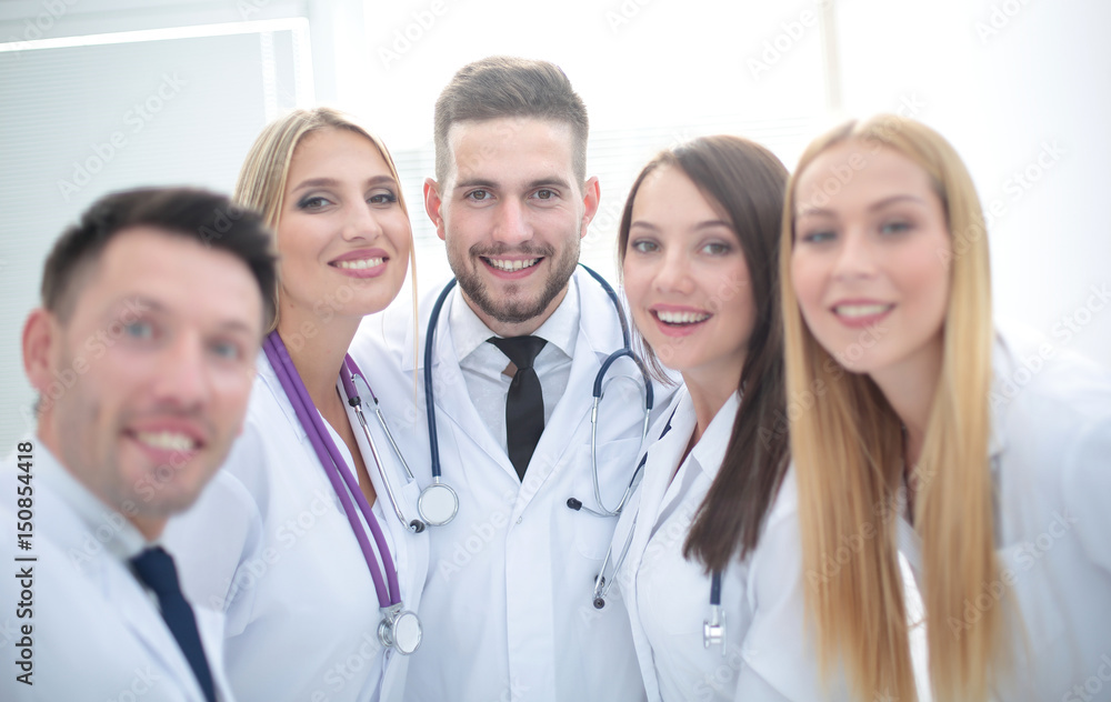 Cheerful team of doctors and interns make selfie Cheerful team of doctors and interns make selfie