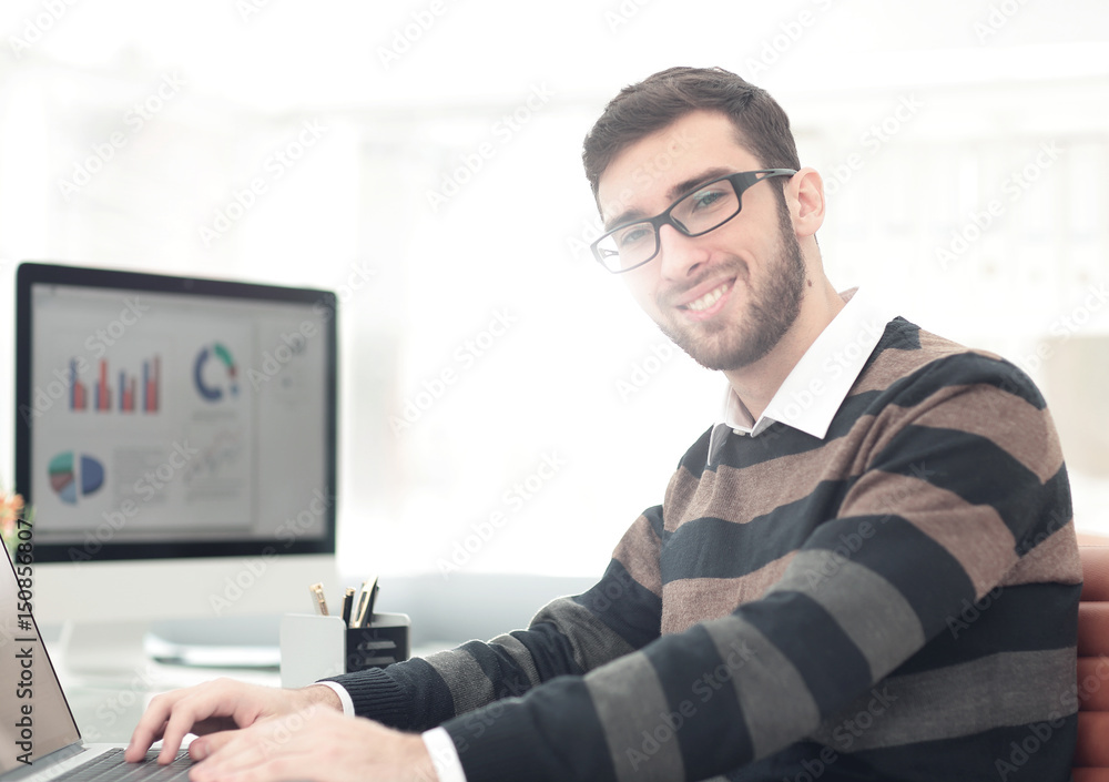 Successul business man working in an modern sunny office. Analyz Successul business man working in an modern sunny office. Analyz