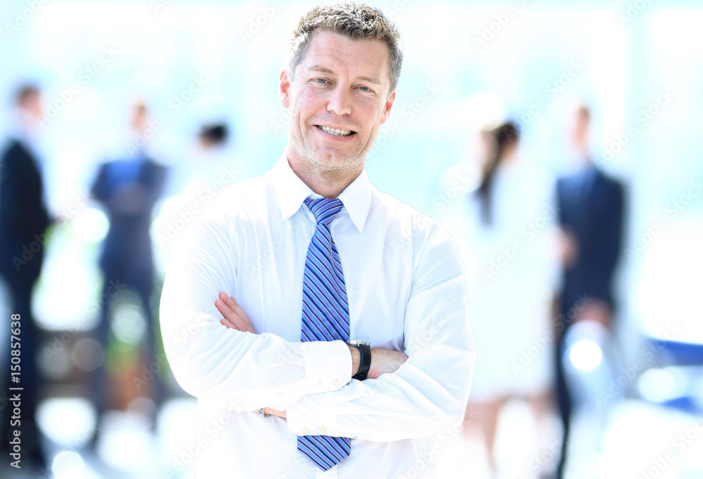 Portrait of happy smiling businessman in a modern office Portrait of happy smiling businessman in a modern office