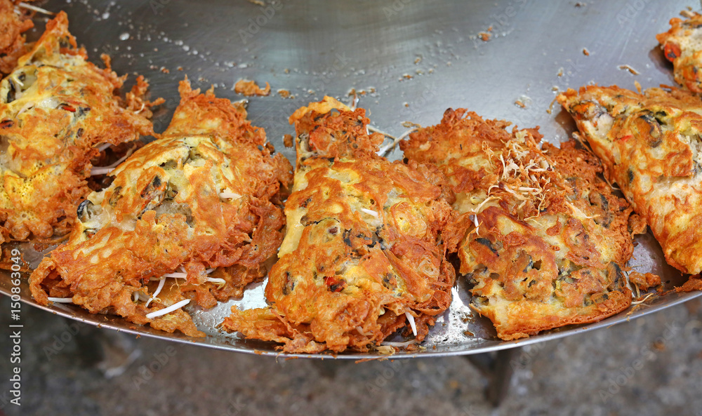 Delicious crispy shellfish fried on pan. Delicious crispy shellfish fried on pan.