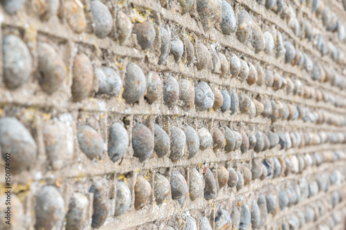 Decorative flint built wall on Rottingdean village church, East Sussex, UK photo