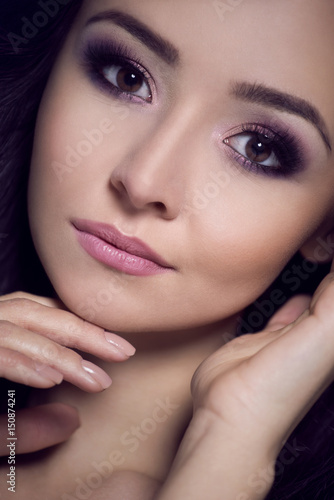Portrait of a beautiful woman in an evening makeup.