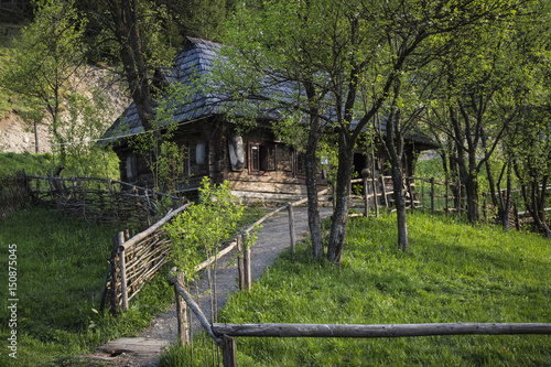 National Ukrainian houses in the mountains. Spring in the Carpathians.