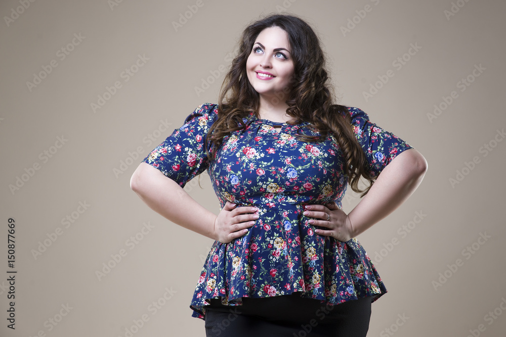 Plus size fashion model in casual clothes, fat woman on studio ...
