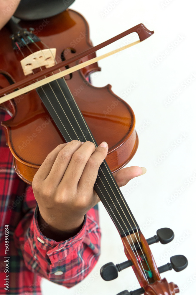 Young man playing violin in isolated white background. Young man playing violin in isolated white background.