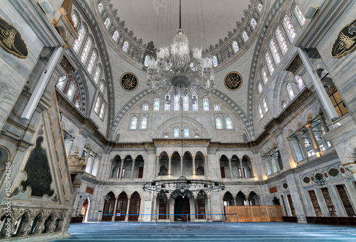 Interior of Nuruosmaniye Mosque, an Ottoman Baroque style mosque completed in 1755, with a huge dome & many colored stained glass windows located in Shemberlitash, Fatih, Istanbul, Turkey