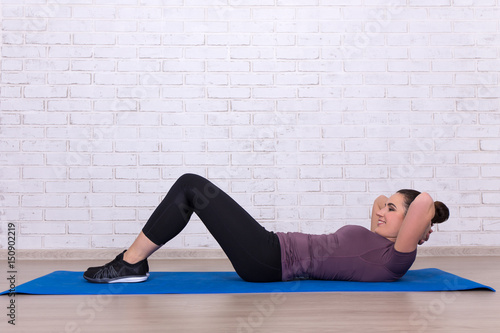 woman doing exercises for abdominal muscles