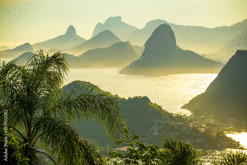 Golden sunset scenic view of the dramatic landscape setting of Rio de Janeiro, Brazil with Guanabara Bay
