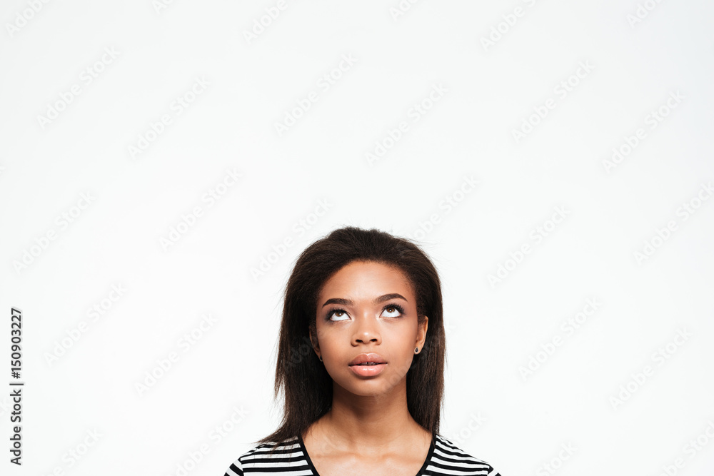 Thoughtful young african lady looking aside. Thoughtful young african lady looking aside.