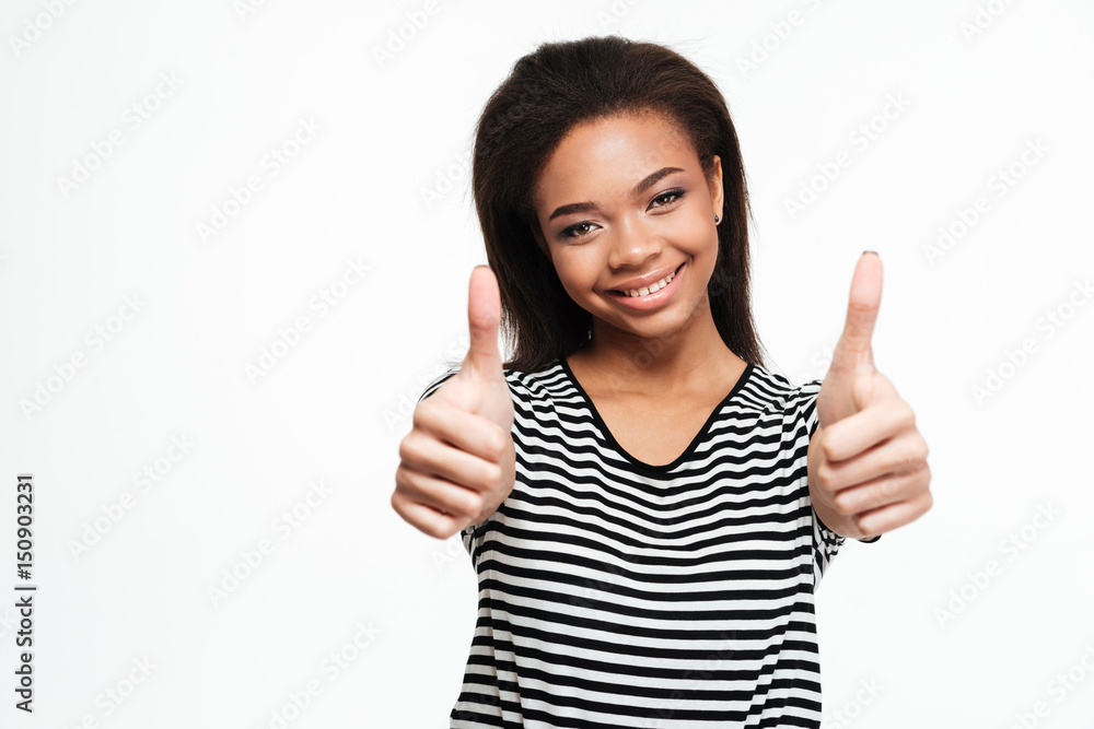 Happy young african lady showing thumbs up Happy young african lady showing thumbs up