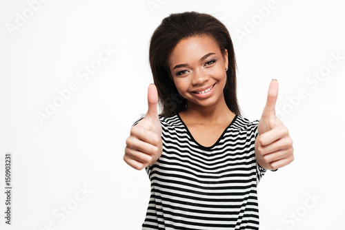 Happy young african lady showing thumbs up