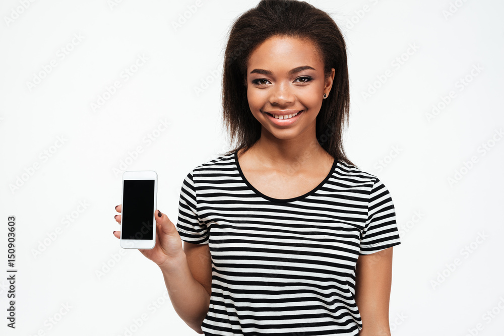 Happy young african lady showing display of phone. Happy young african lady showing display of phone.