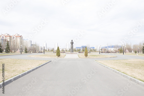 A monument in Victory Park. Kazan in Russia. Girl with a flower in her hand
