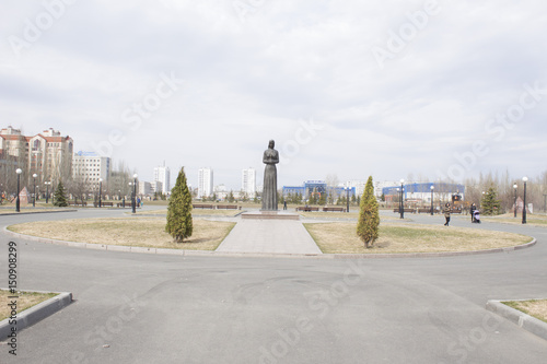 A monument in Victory Park. Kazan in Russia. Girl with a flower in her hand