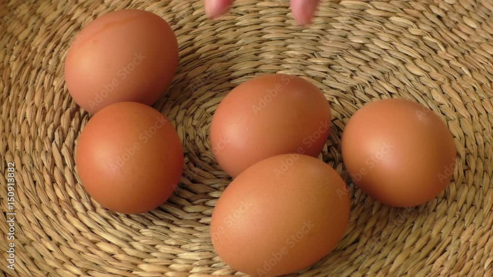 Fresh brown egg in a basket, chicken egg
Fresh brown egg in a basket, chicken egg