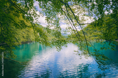 Plitvice Lakes National Park beautiful emerald lake in the forest, famous tourist destination in Croatia, nature summer background