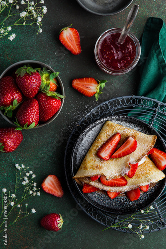 crepes served with cream cheese and fresh strawberry