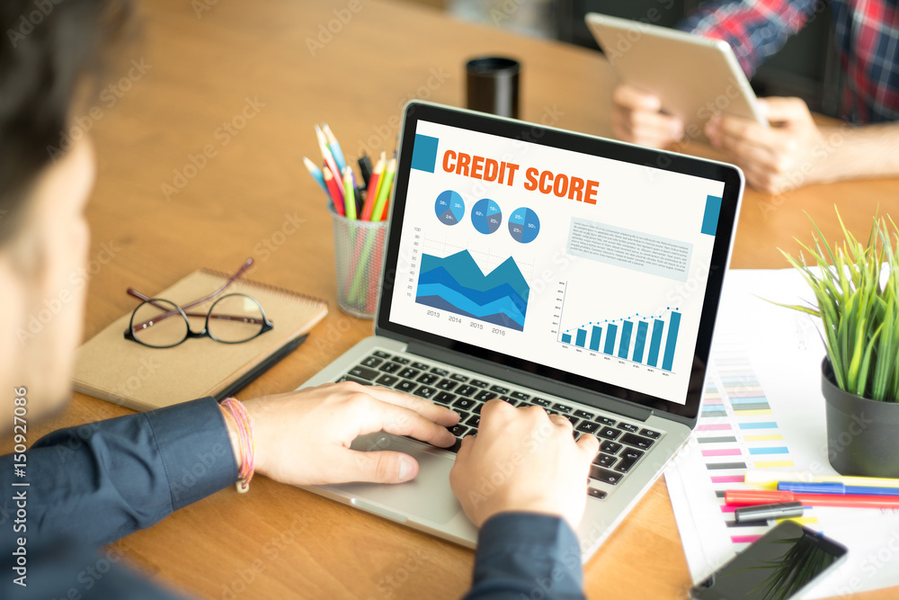 Fototapeta premium Business Charts and Graphs on screen with CREDIT SCORE title