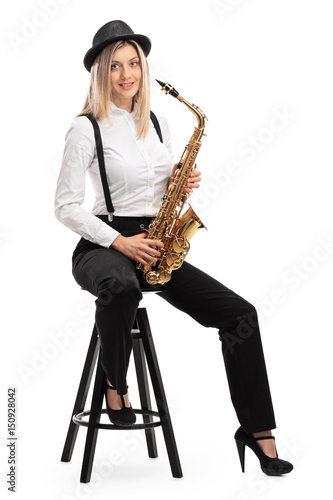 Female jazz musician with a saxophone sitting on a chair