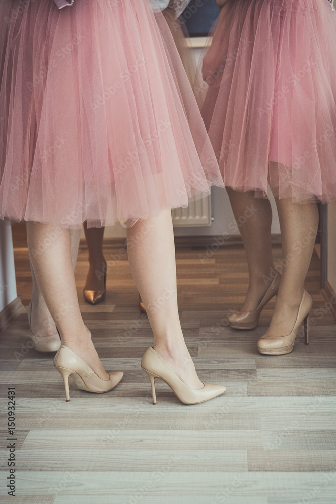 Women wearing nude colored tulle skirts Women wearing nude colored tulle skirts